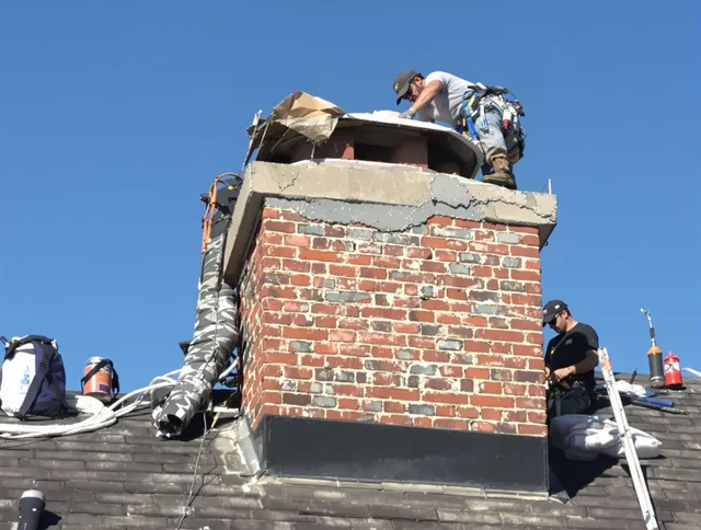 Bell Chimney Sweep installing a custom chimney crown in Bell, CA