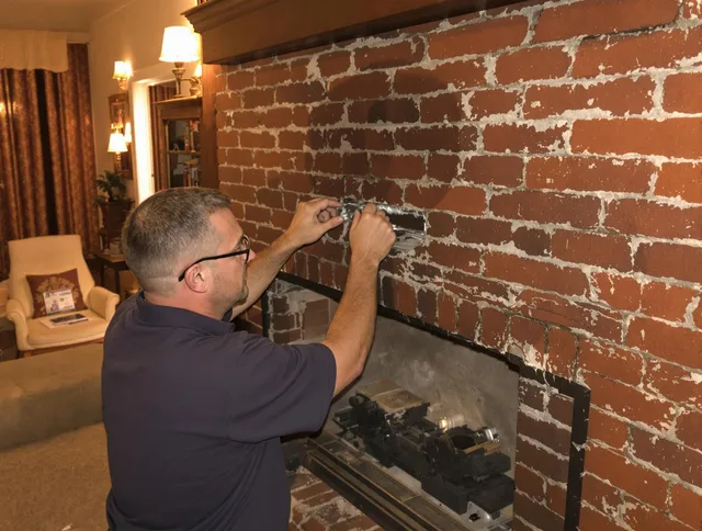 Bell Chimney Sweep expert fixing a fireplace in Bell, CA